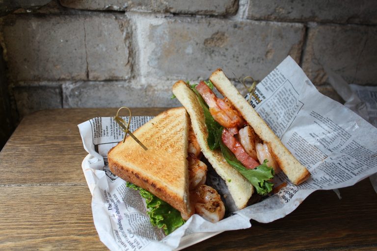 Fried Shrimp Sandwich with lettuce and tomato at A.W. Shuck’s